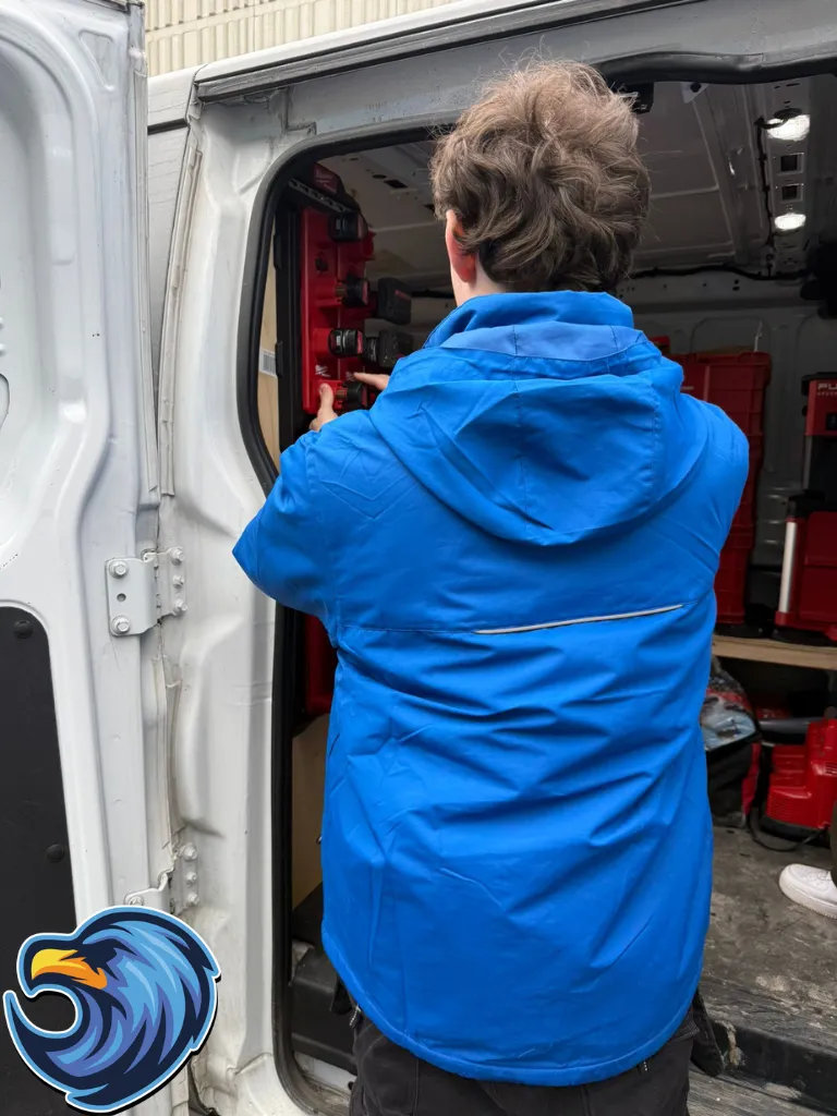 Delta Plumber taking out plumbing tool from a plumbing truck in Niagara Falls