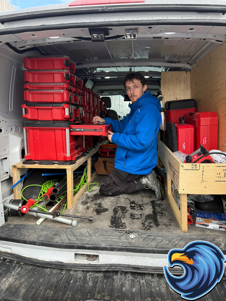 Plumber taking out tools from a plumbing truck - Delta Plumbers of Vaughan
