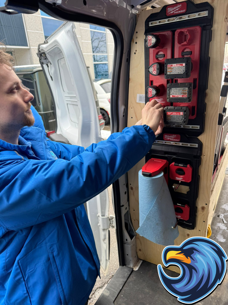 Plumber taking plumbing tools from truck - Delta Plumbers Welland