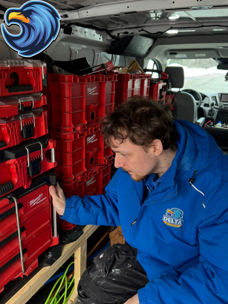 Plumber with plumbing tools in a plumbing truck in Guelph - Delta Plumbers